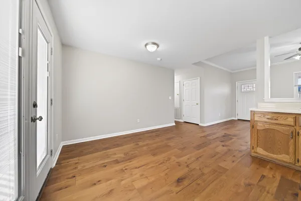 a kitchen with stainless steel appliances granite countertop a refrigerator sink and stove