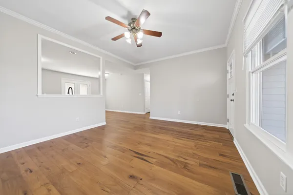 a bathroom with a sink a large mirror and a light fixture
