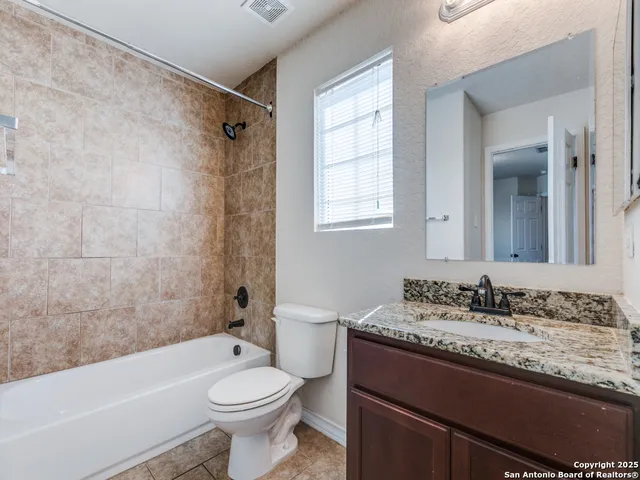 a view of a backyard with plants and a garden