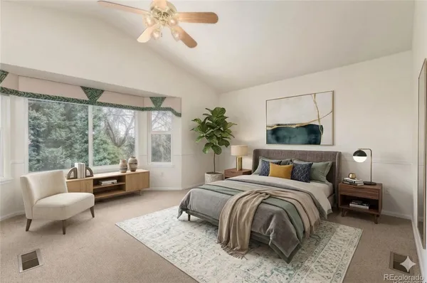 a bedroom with a bed and a couch