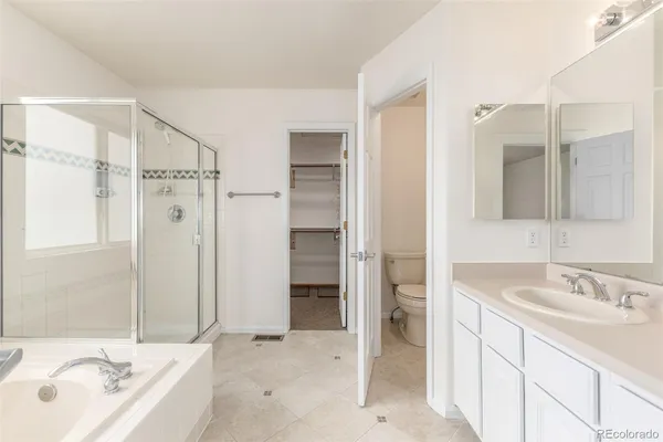 a bathroom with a sink double vanity and a shower