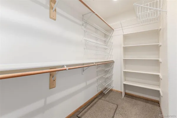 a view of an empty walk in closet