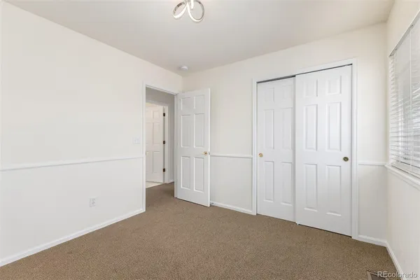 a view of a closet area with empty room