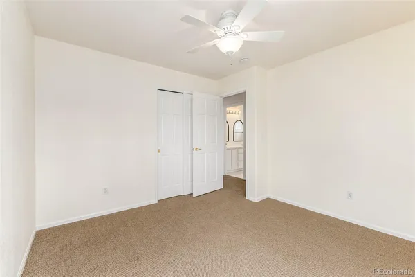 a bathroom with a double vanity sink toilet and a mirror