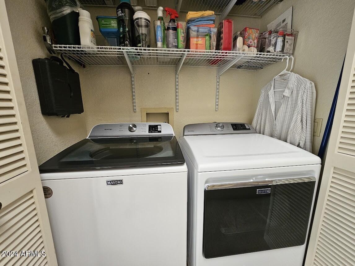10015 East Mountain View Road, Unit 1002 Scottsdale, AZ 85258 - Photo 20 of 24 a utility room with dryer and washer