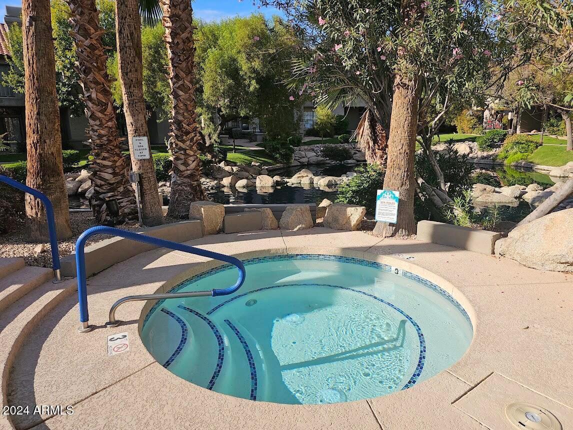 10015 East Mountain View Road, Unit 1002 Scottsdale, AZ 85258 - Photo 23 of 24 swimming pool view with a outdoor seating