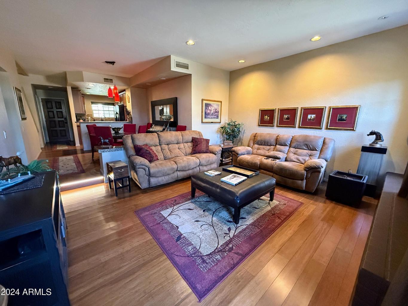 10015 East Mountain View Road, Unit 1002 Scottsdale, AZ 85258 - Photo 3 of 24 a living room with furniture and a rug