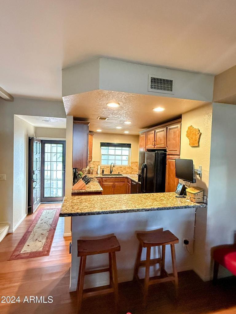 10015 East Mountain View Road, Unit 1002 Scottsdale, AZ 85258 - Photo 8 of 24 a dining room with furniture and window