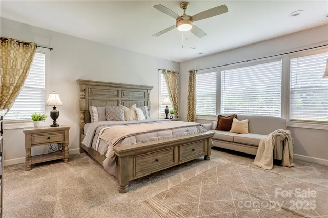 a spacious bedroom with a bed and a couch