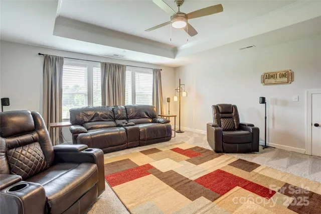 a living room with furniture and a rug