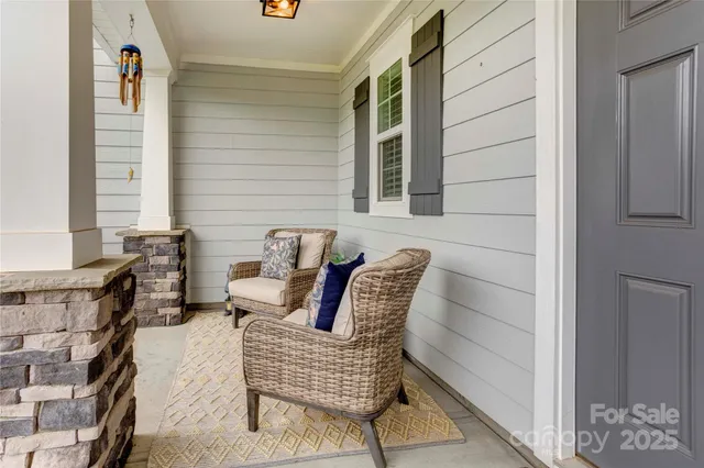 a view of balcony with furniture