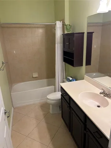 a view of a room with wooden floor and window