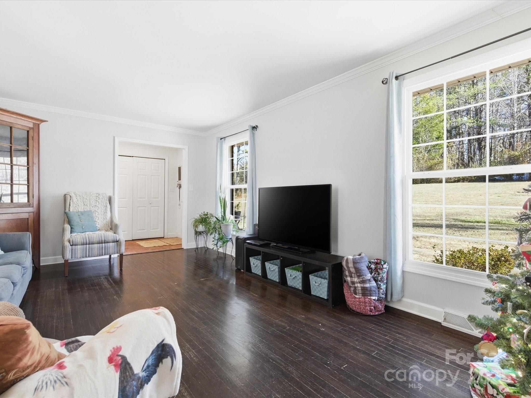9941 Ferguson Road Charlotte, NC 28227 - Photo 12 of 29 a living room with furniture and a flat screen tv