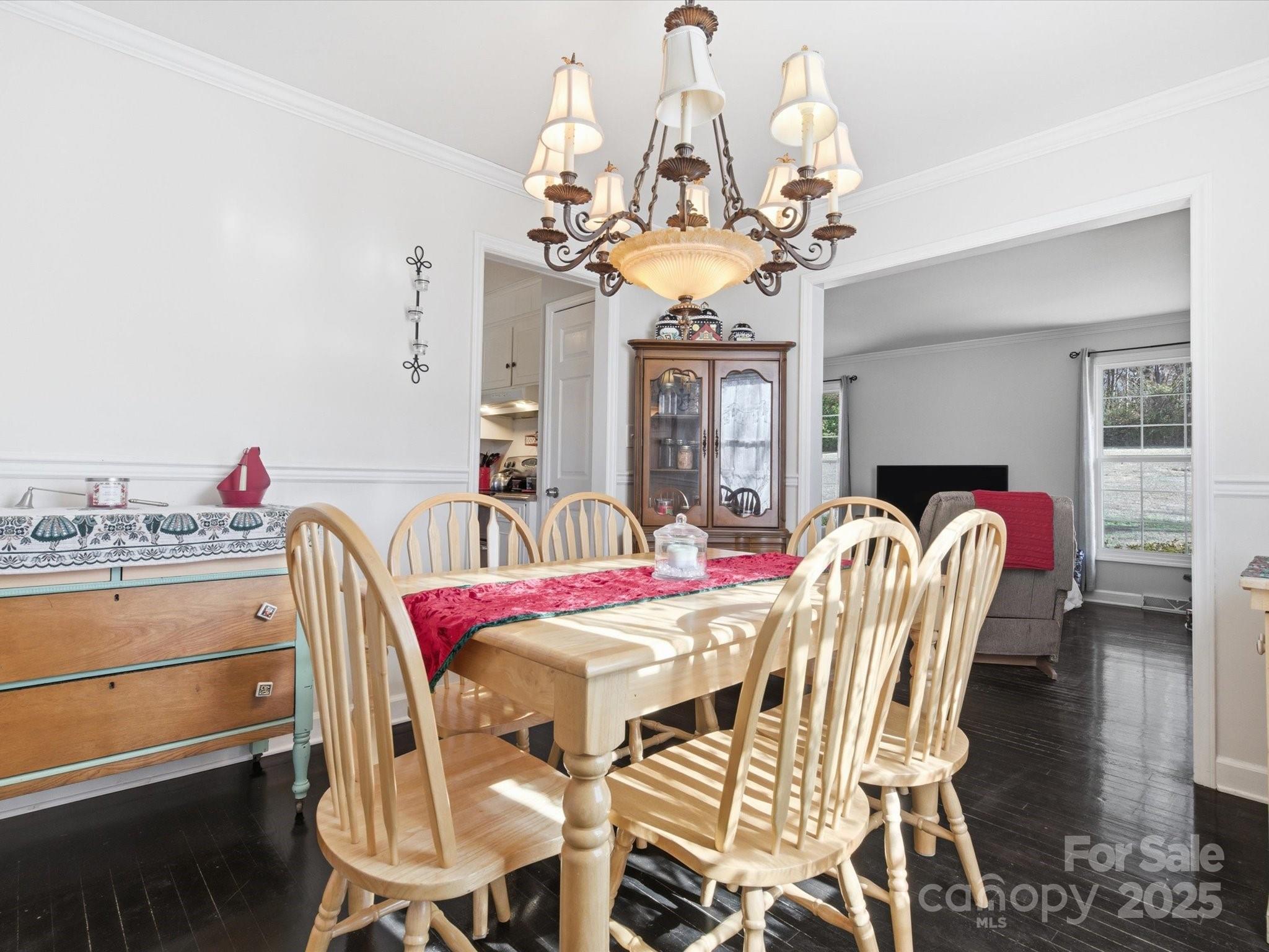 9941 Ferguson Road Charlotte, NC 28227 - Photo 13 of 29 a dining room filled chandelier and wooden floor