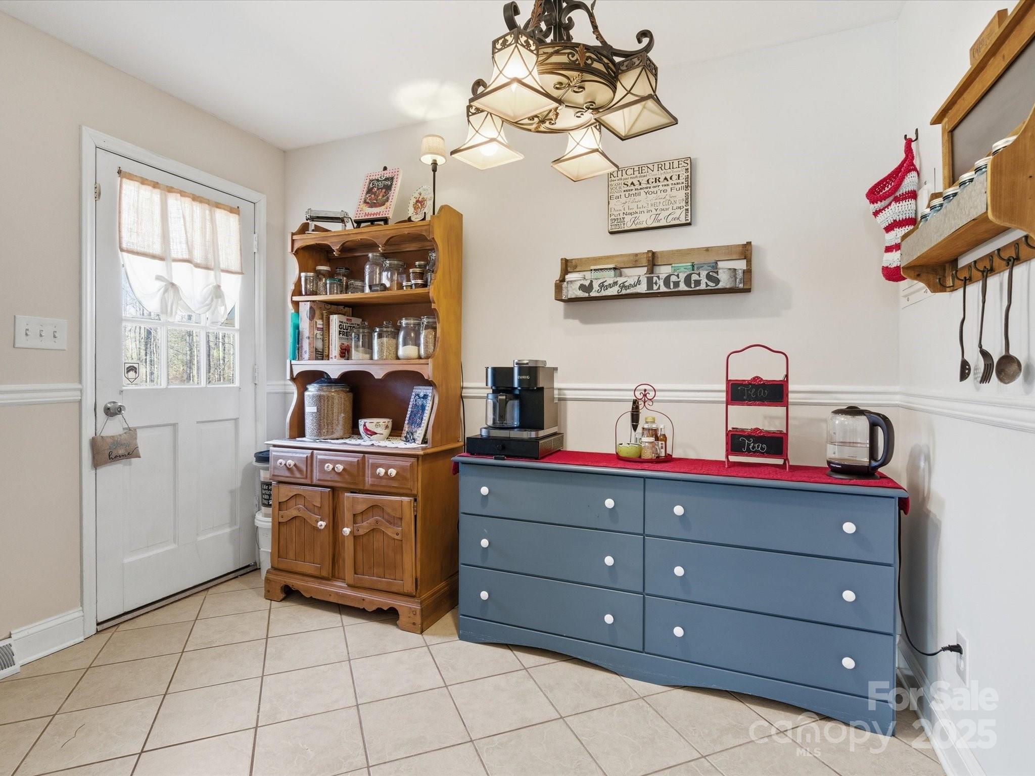 9941 Ferguson Road Charlotte, NC 28227 - Photo 18 of 29 a room with a cabinets and window