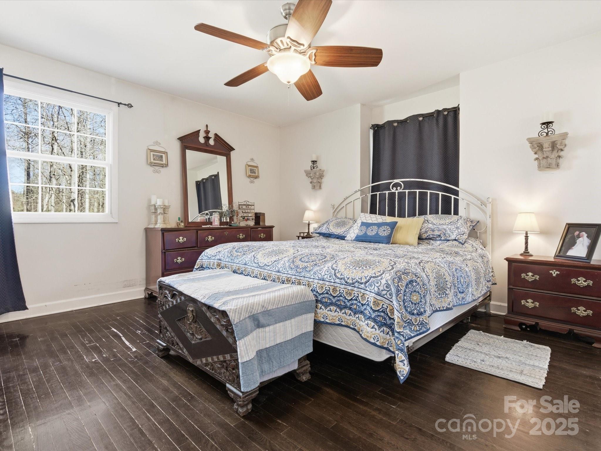 9941 Ferguson Road Charlotte, NC 28227 - Photo 22 of 29 a bedroom with a bed lamp closet and large window