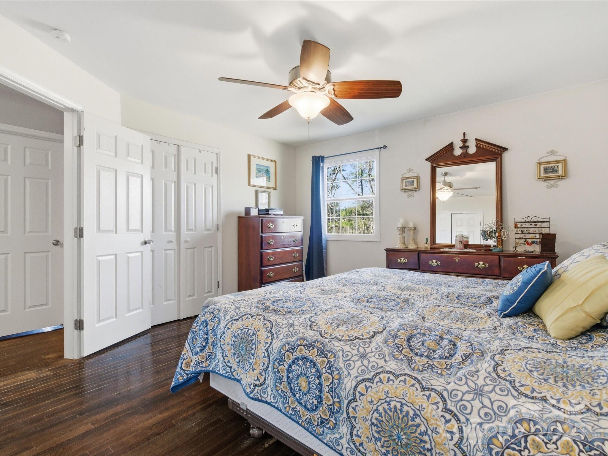 9941 Ferguson Road Charlotte, NC 28227 - Photo 23 of 29 a bedroom with a large bed and a chandelier
