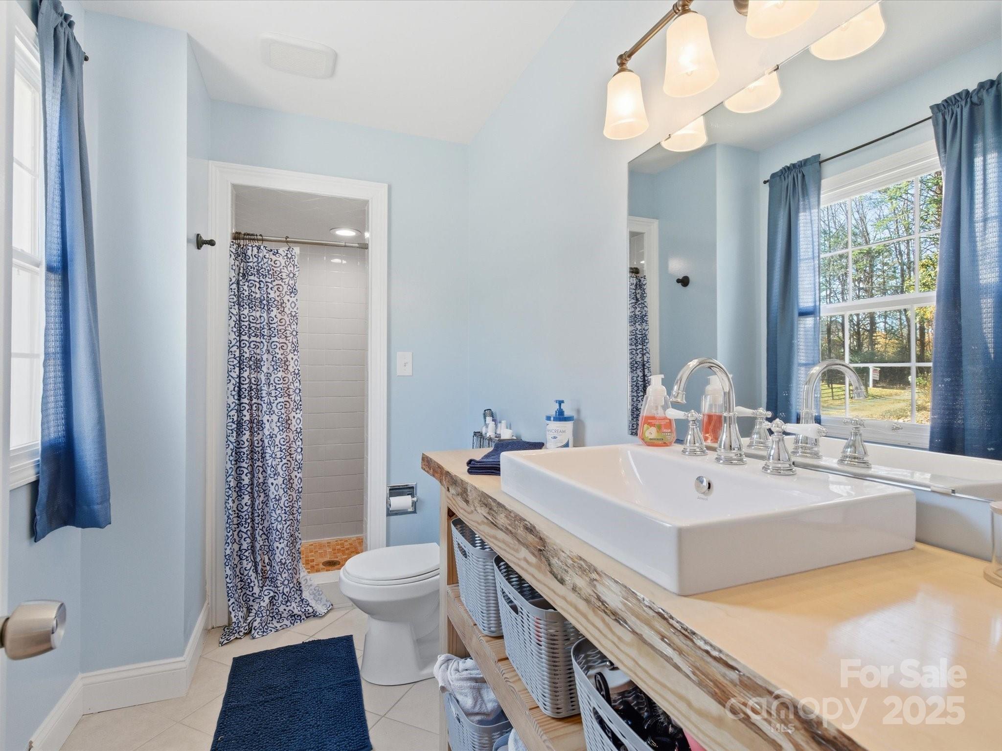 9941 Ferguson Road Charlotte, NC 28227 - Photo 24 of 29 a view of bathroom with dual sinks