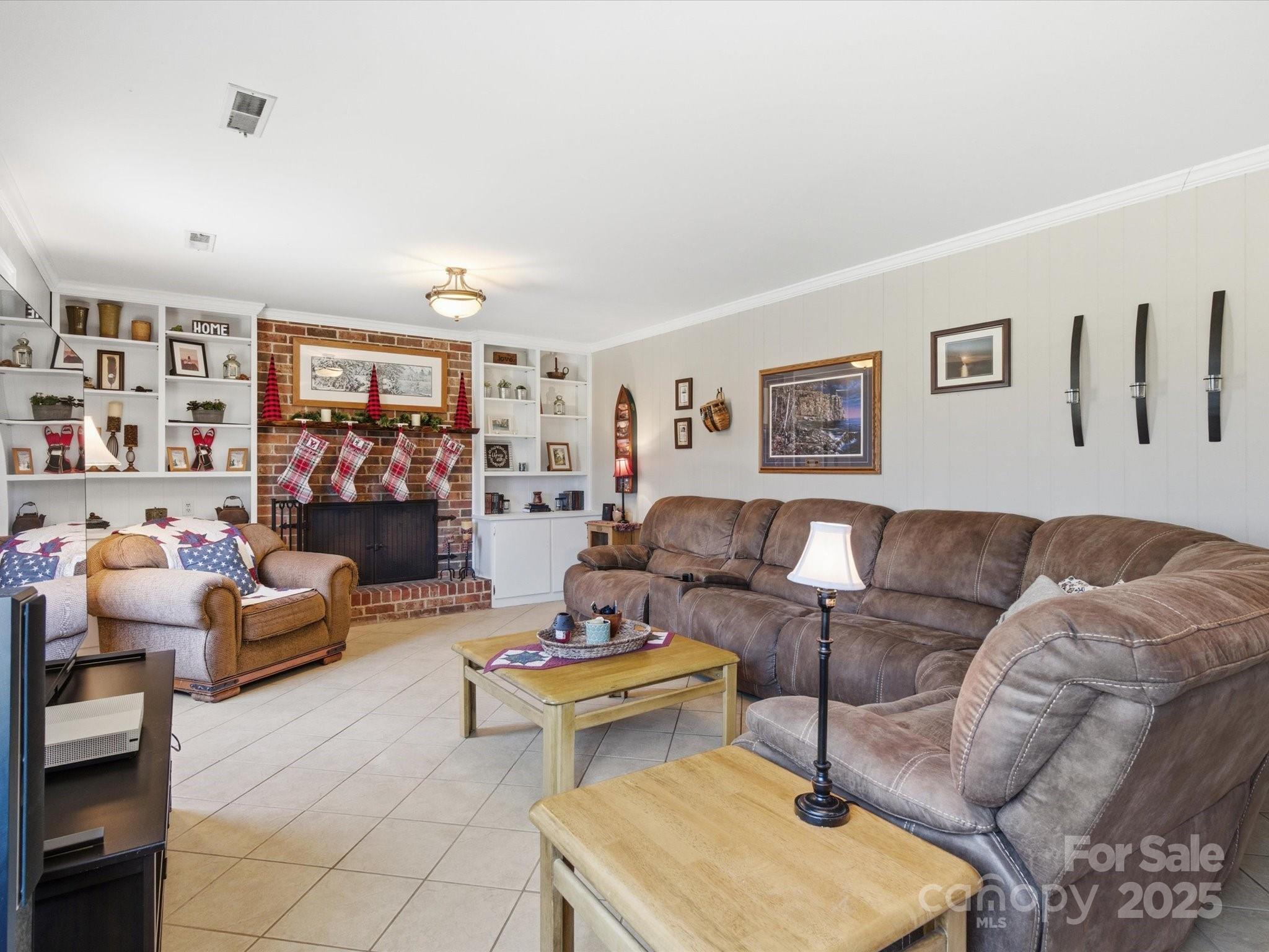 9941 Ferguson Road Charlotte, NC 28227 - Photo 26 of 29 a living room with furniture and a bookshelf