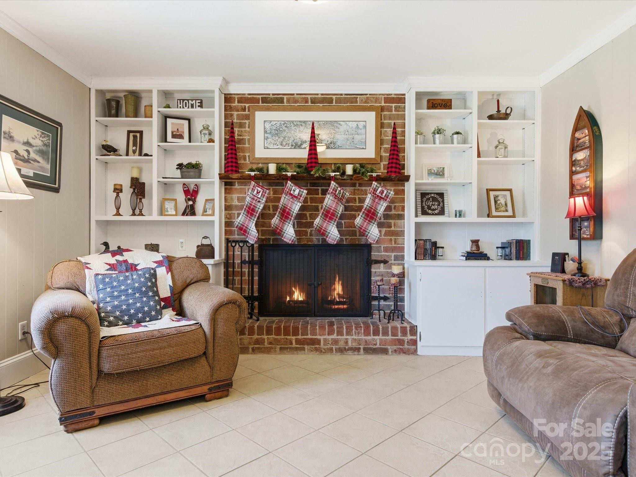 9941 Ferguson Road Charlotte, NC 28227 - Photo 27 of 29 a living room with furniture and a fireplace