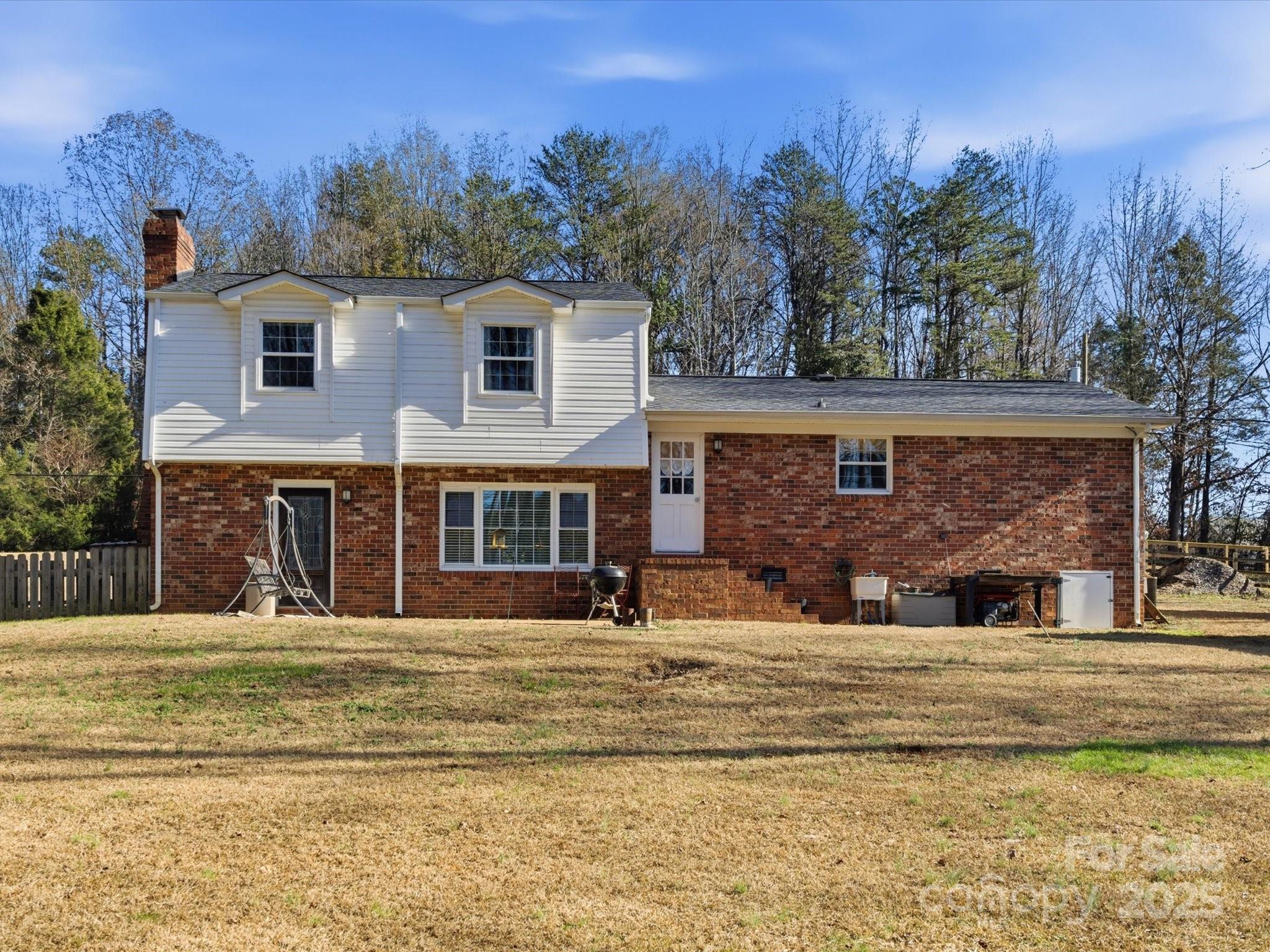 9941 Ferguson Road Charlotte, NC 28227 - Photo 6 of 29 a view of a house with a yard