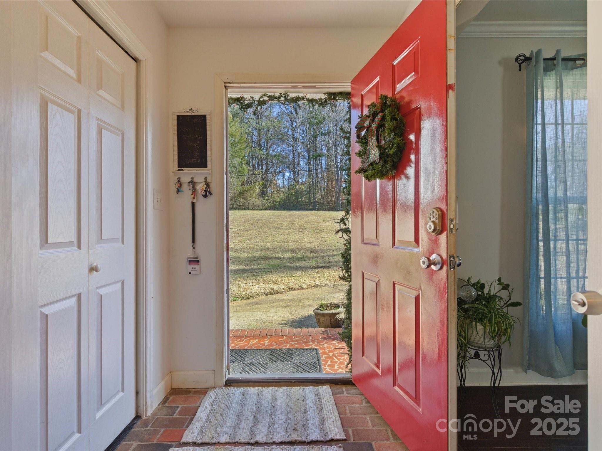 9941 Ferguson Road Charlotte, NC 28227 - Photo 8 of 29 a view of a entryway door of the house and living room