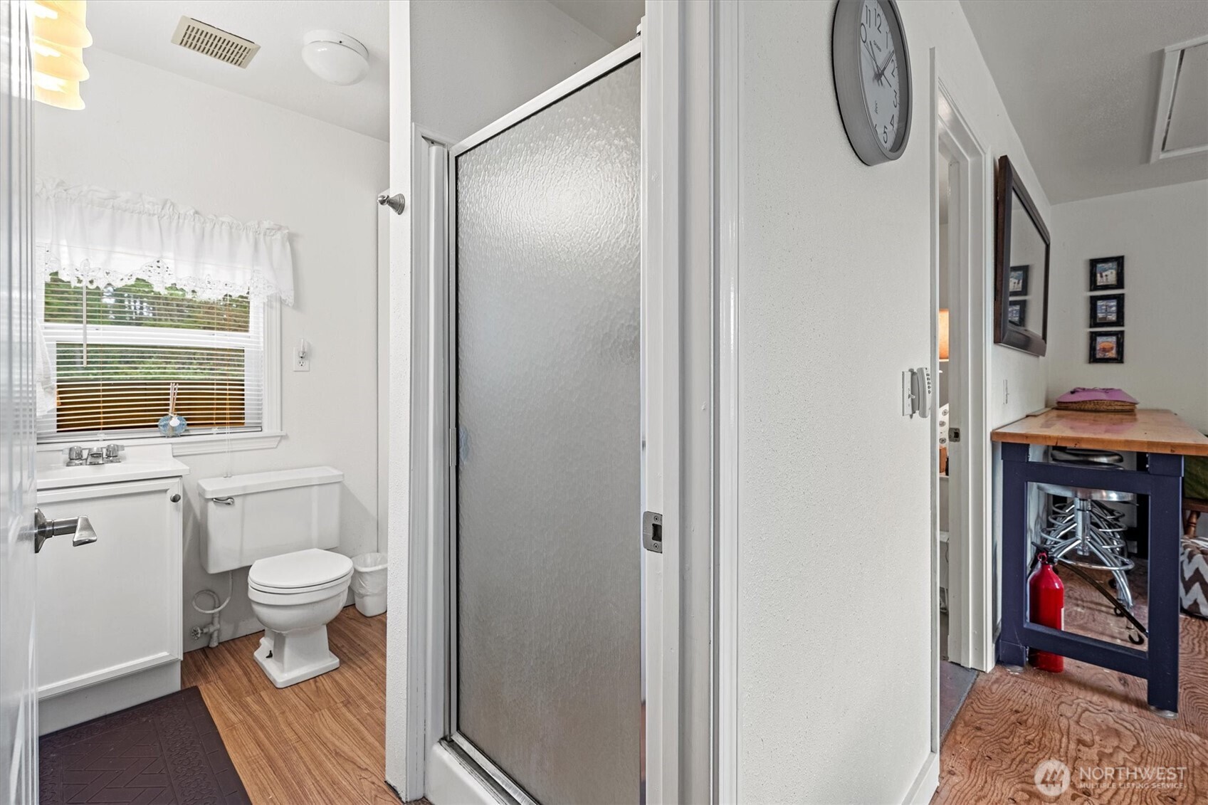 11303 Pacific Way Long Beach, WA 98631 - Photo 24 of 40 a bathroom with a toilet and a shower curtain