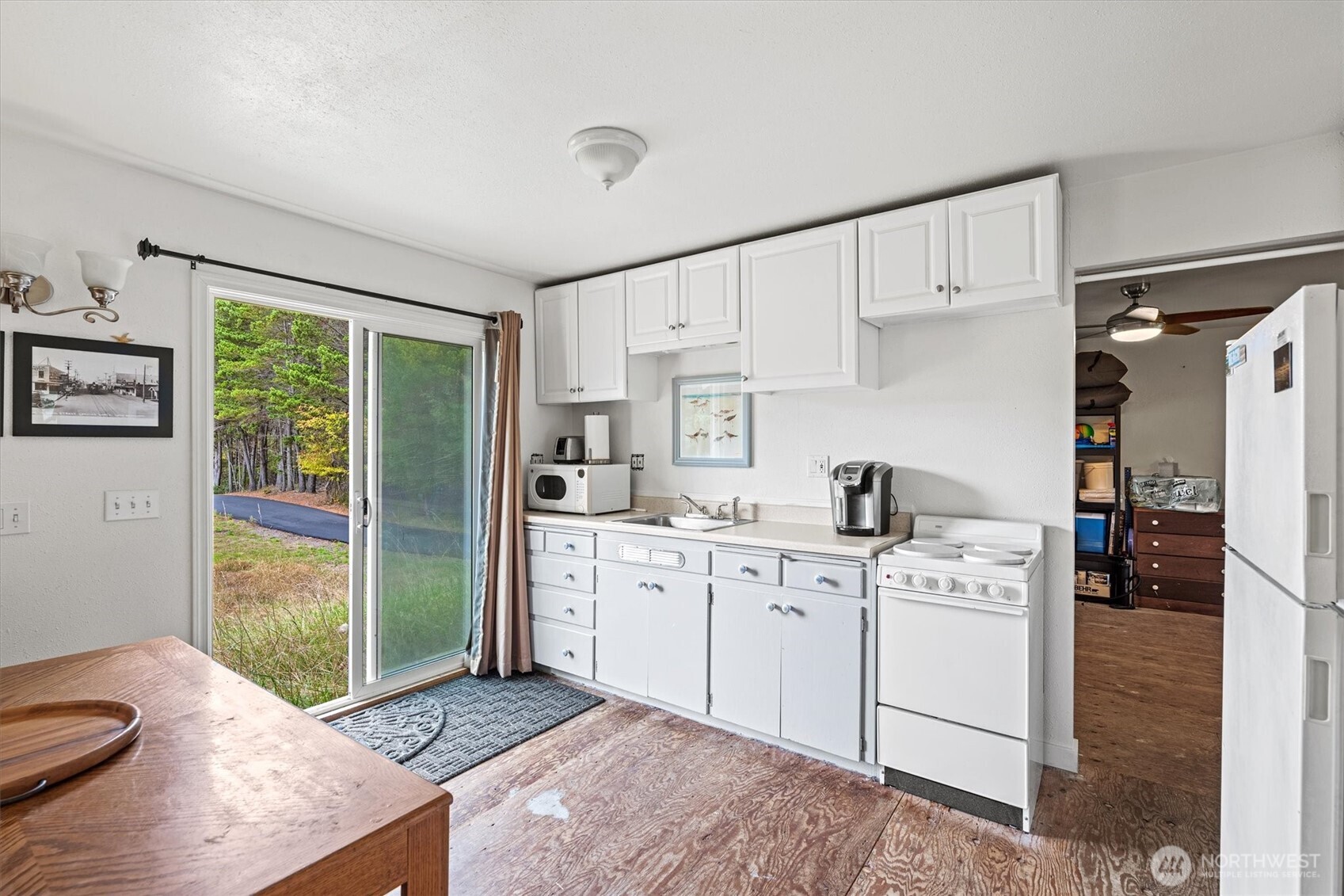 11303 Pacific Way Long Beach, WA 98631 - Photo 8 of 40 a kitchen with stainless steel appliances granite countertop a sink stove and refrigerator