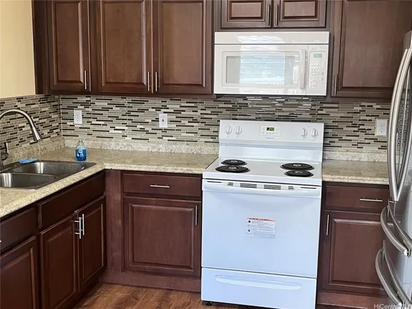 a kitchen with a stove and a sink