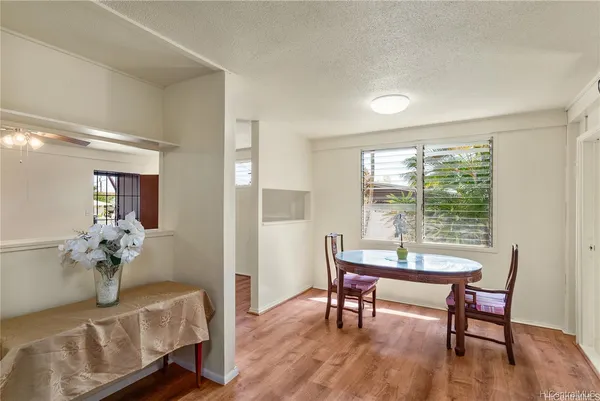 a view of a livingroom with furniture window and wooden floor
