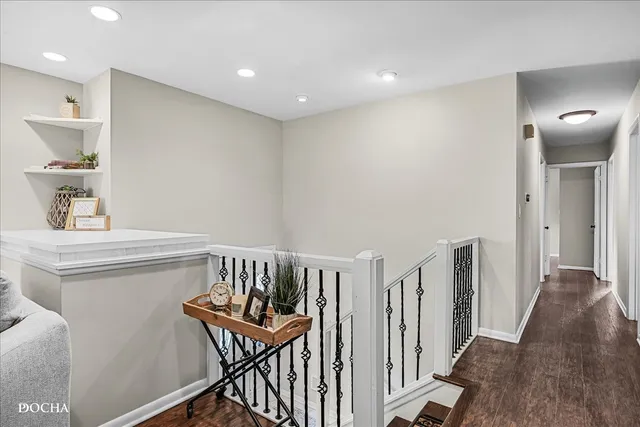 a view of a hallway with seating area
