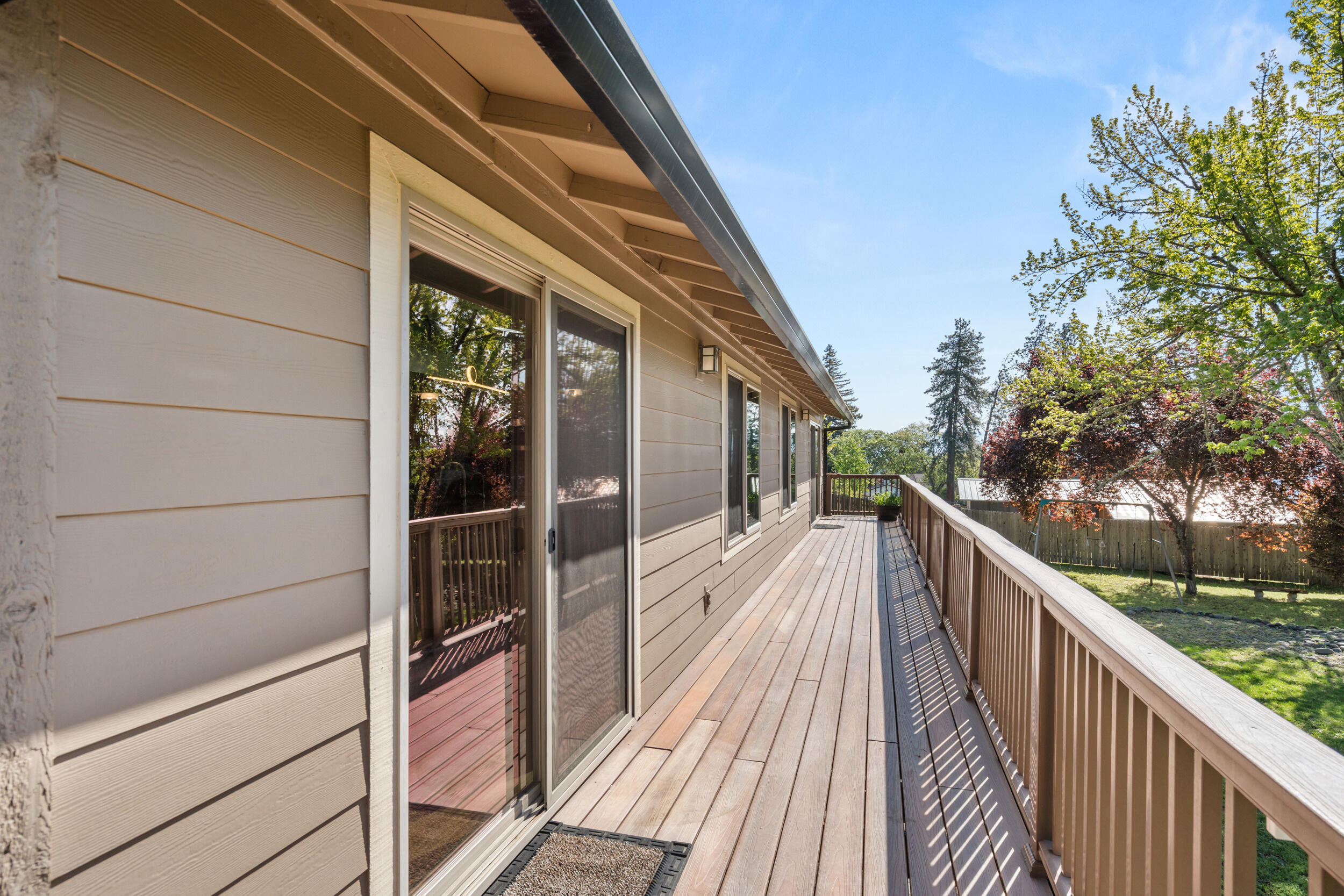 3583 Ross Lane Central Point, OR 97502 - Photo 29 of 52 a view of a balcony with wooden floor and fence