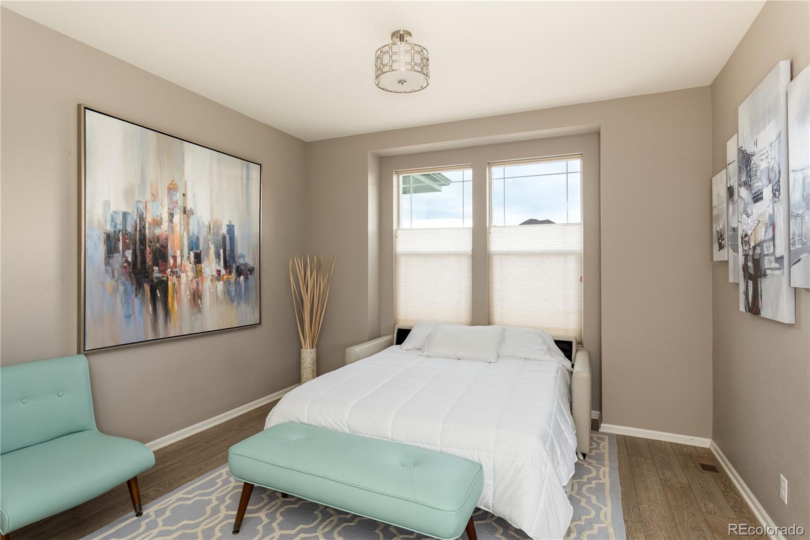 2834 Macon Way Denver, CO 80238 - Photo 11 of 36 a bedroom with a bed and a window