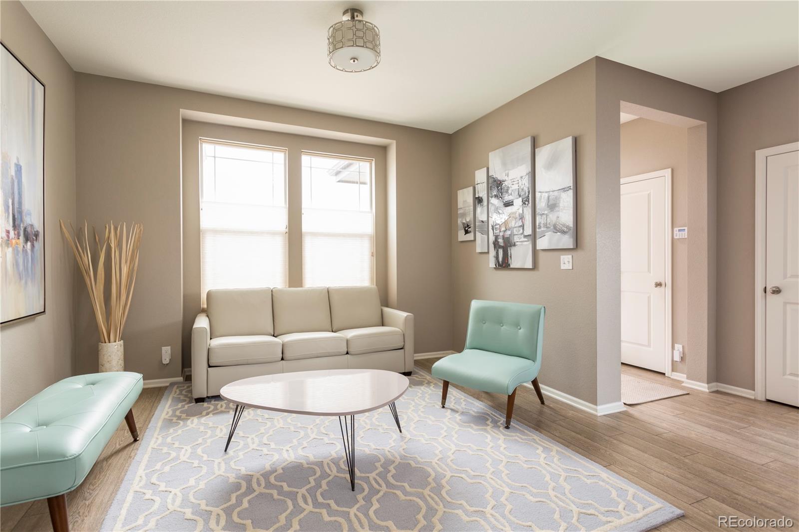 2834 Macon Way Denver, CO 80238 - Photo 12 of 36 a living room with furniture and a window