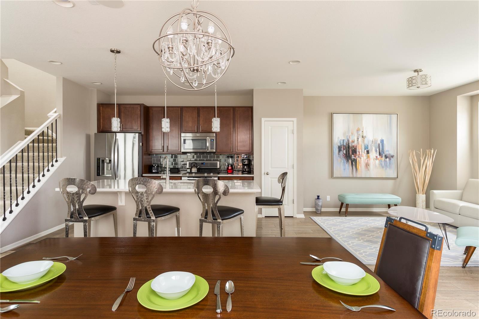 2834 Macon Way Denver, CO 80238 - Photo 14 of 36 a view of a dining room with furniture wooden floor and chandelier