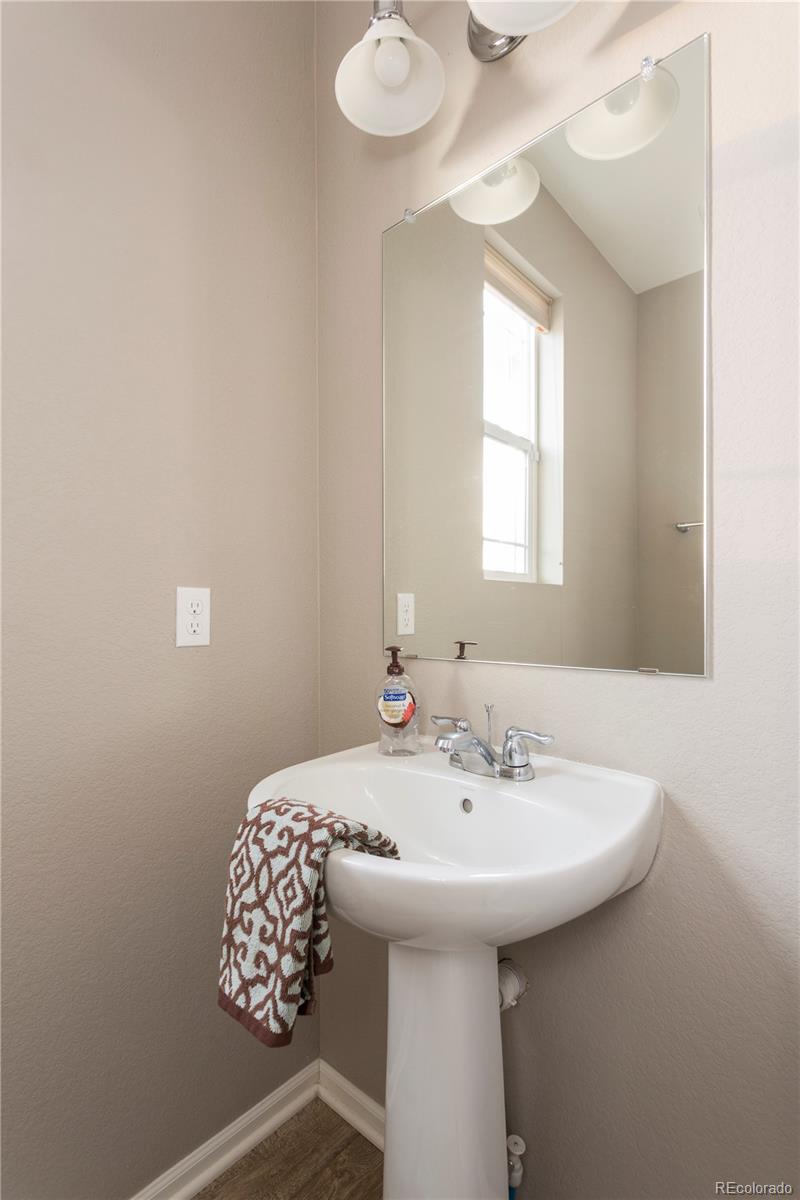 2834 Macon Way Denver, CO 80238 - Photo 16 of 36 a bathroom with a sink and a mirror