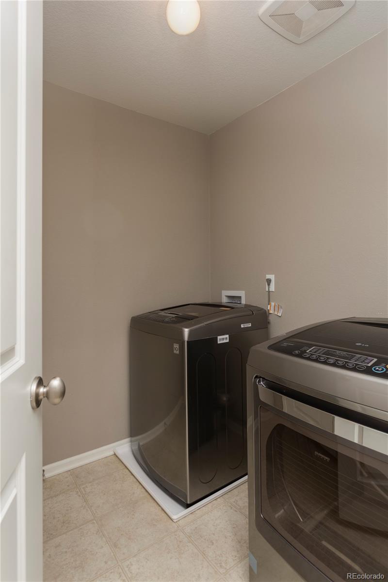 2834 Macon Way Denver, CO 80238 - Photo 30 of 36 a view of a livingroom with washer and dryer