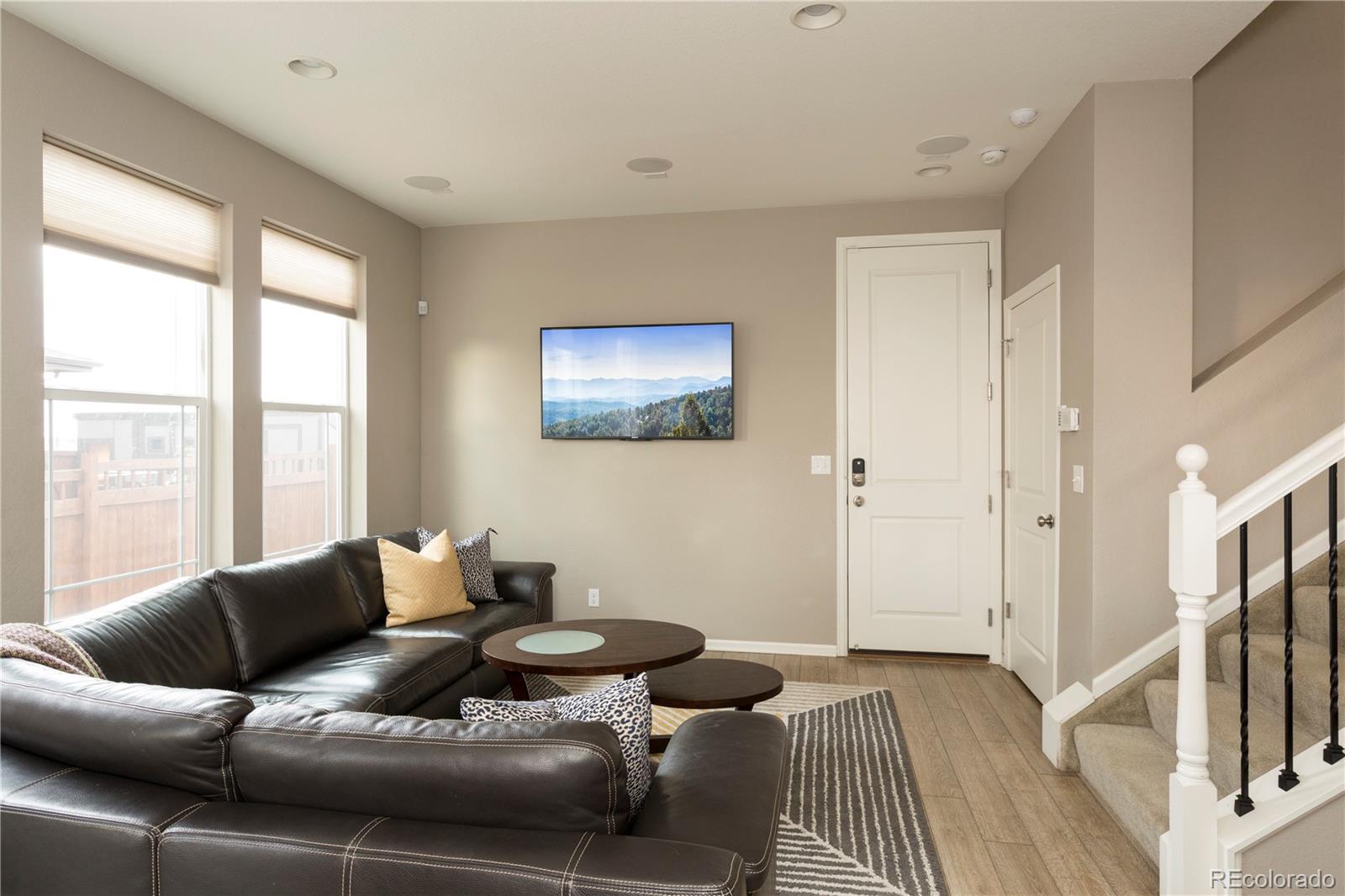 2834 Macon Way Denver, CO 80238 - Photo 6 of 36 a living room with furniture and a flat screen tv