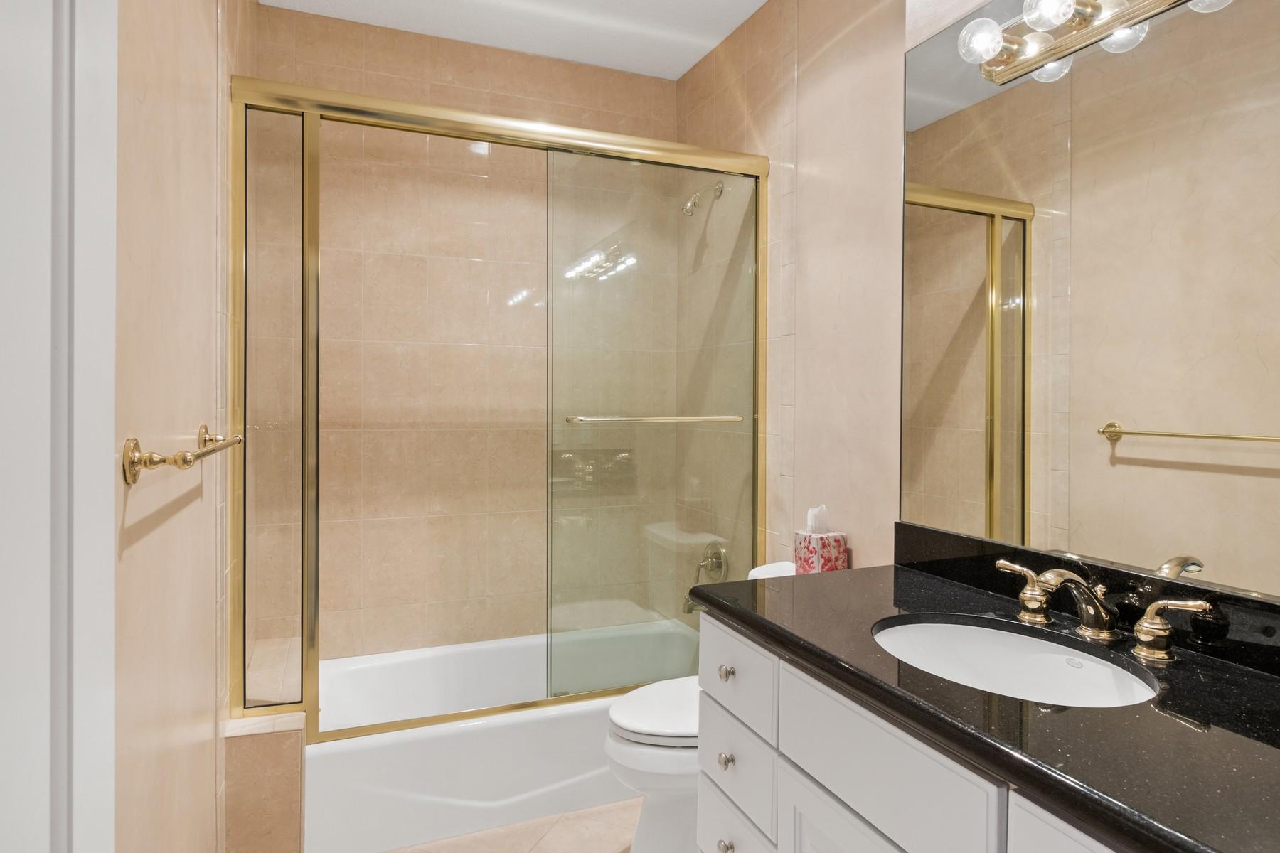 275 South Beach Road, Unit C203 Jupiter, FL 33469 - Photo 14 of 21 a bathroom with a granite countertop sink toilet and shower