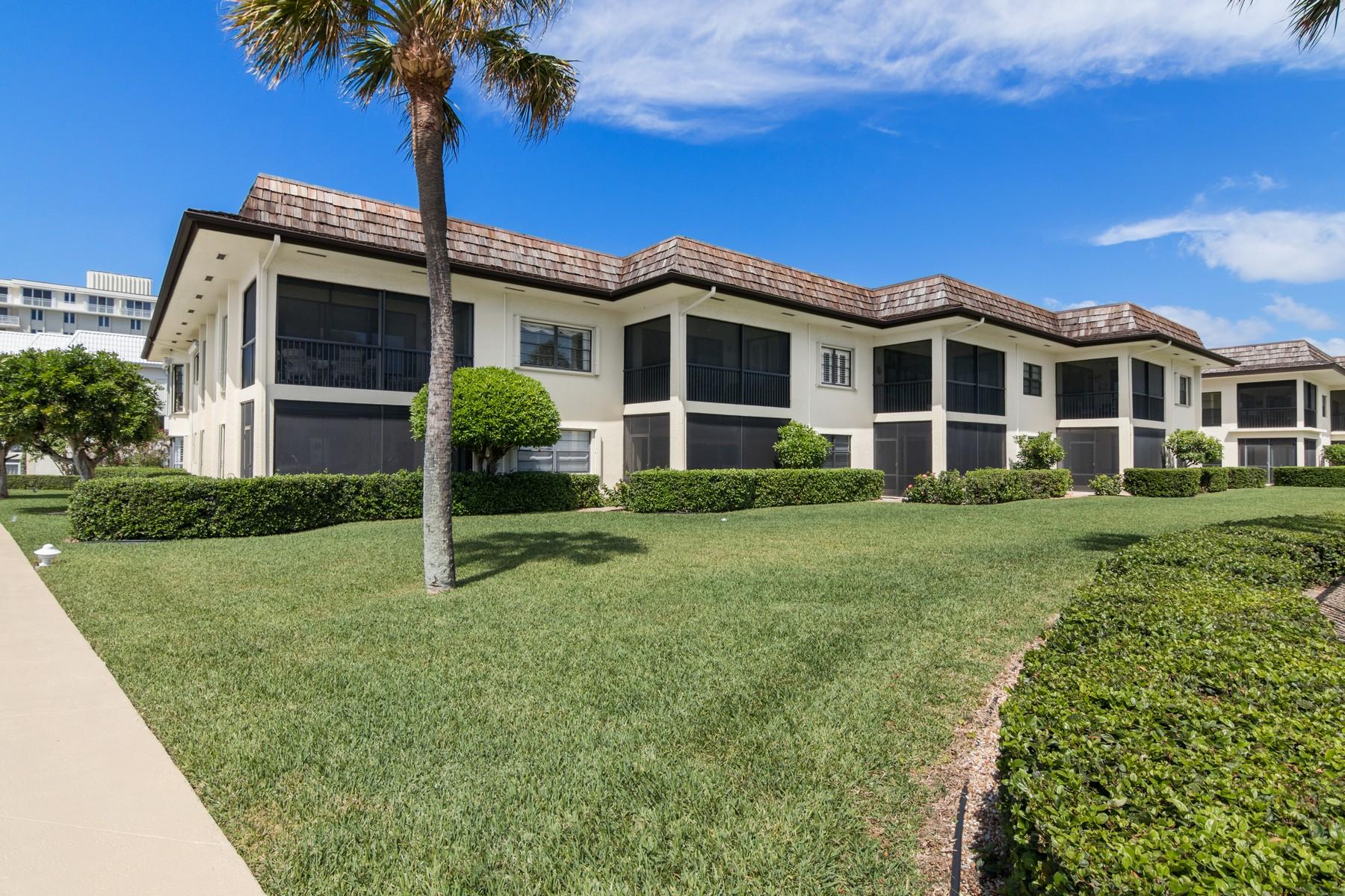 275 South Beach Road, Unit C203 Jupiter, FL 33469 - Photo 4 of 21 a front view of a house with a yard