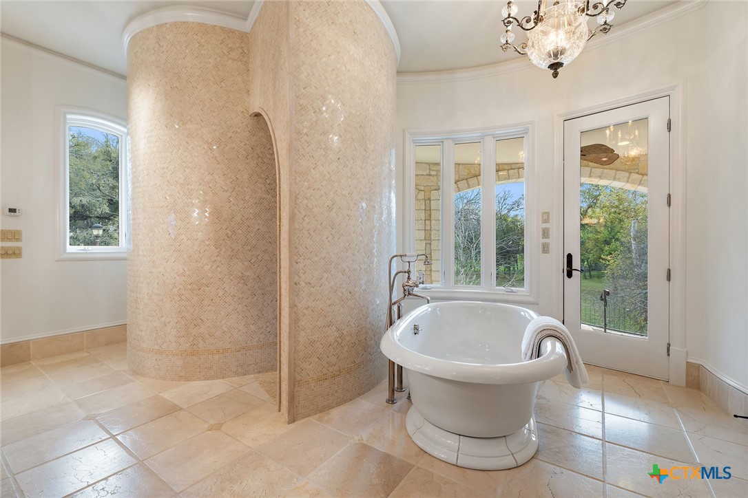 8536 Armstrong Road Belton, TX 76513 - Photo 16 of 41 a white bath tub sitting next to a white toilet