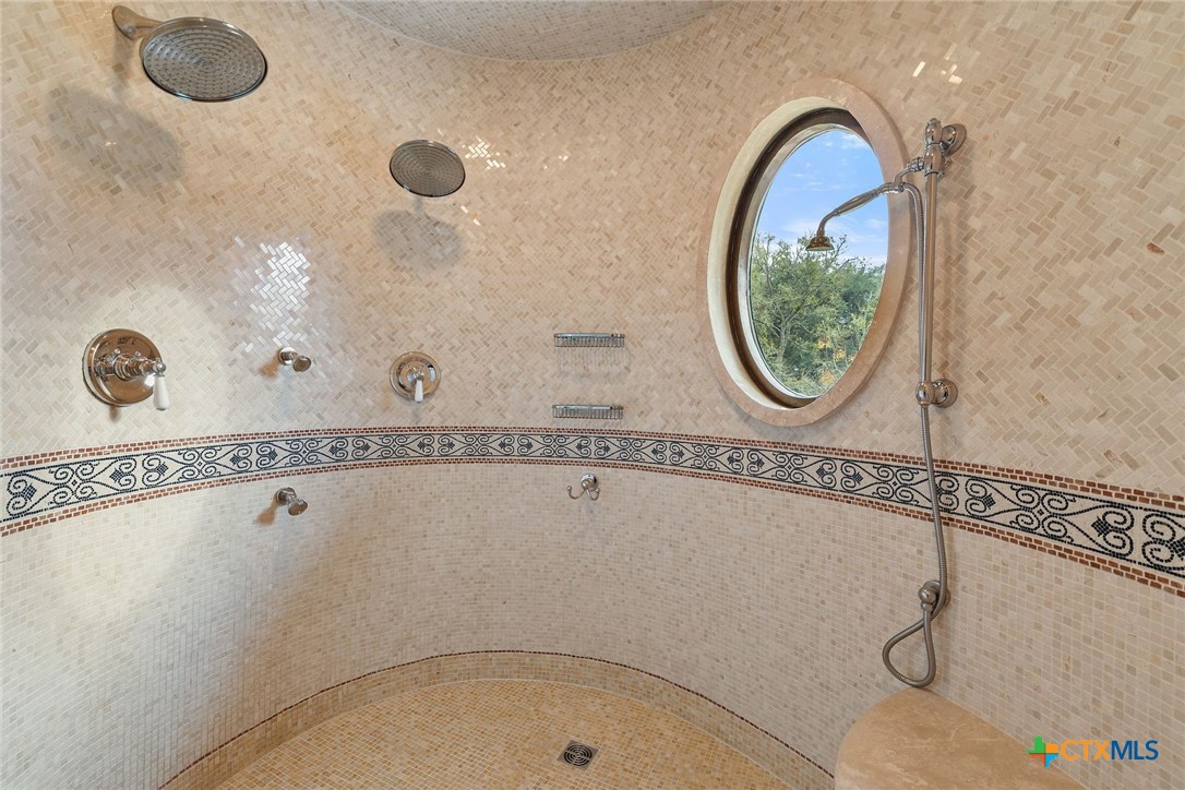 8536 Armstrong Road Belton, TX 76513 - Photo 17 of 41 a bathroom with a tub a mirror and vanity