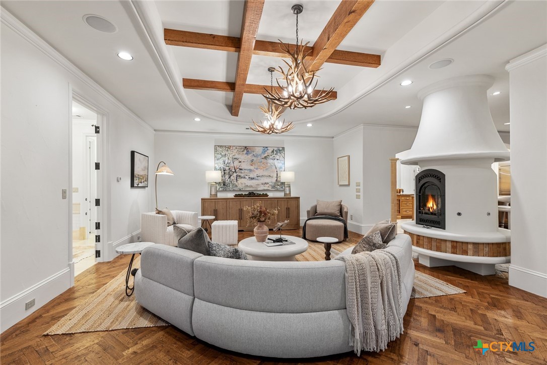 8536 Armstrong Road Belton, TX 76513 - Photo 20 of 41 a living room with furniture a fireplace and a chandelier