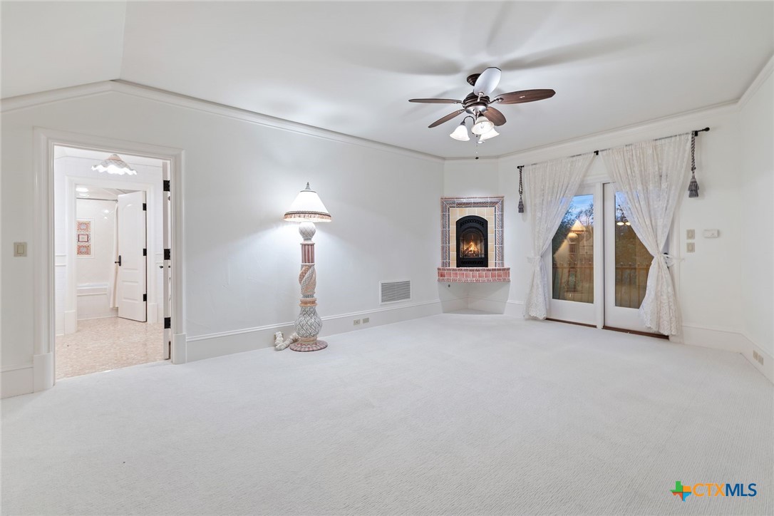 8536 Armstrong Road Belton, TX 76513 - Photo 29 of 41 a view of a livingroom with a ceiling fan closet and a ceiling fan