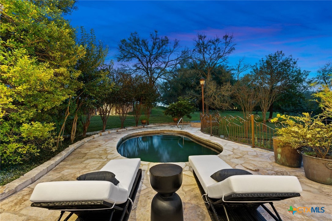 8536 Armstrong Road Belton, TX 76513 - Photo 33 of 41 a view of a chairs and table in patio with a lake view