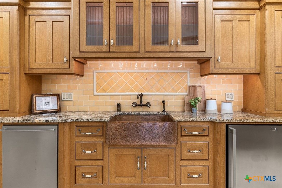 8536 Armstrong Road Belton, TX 76513 - Photo 9 of 41 a kitchen with granite countertop a sink and cabinets