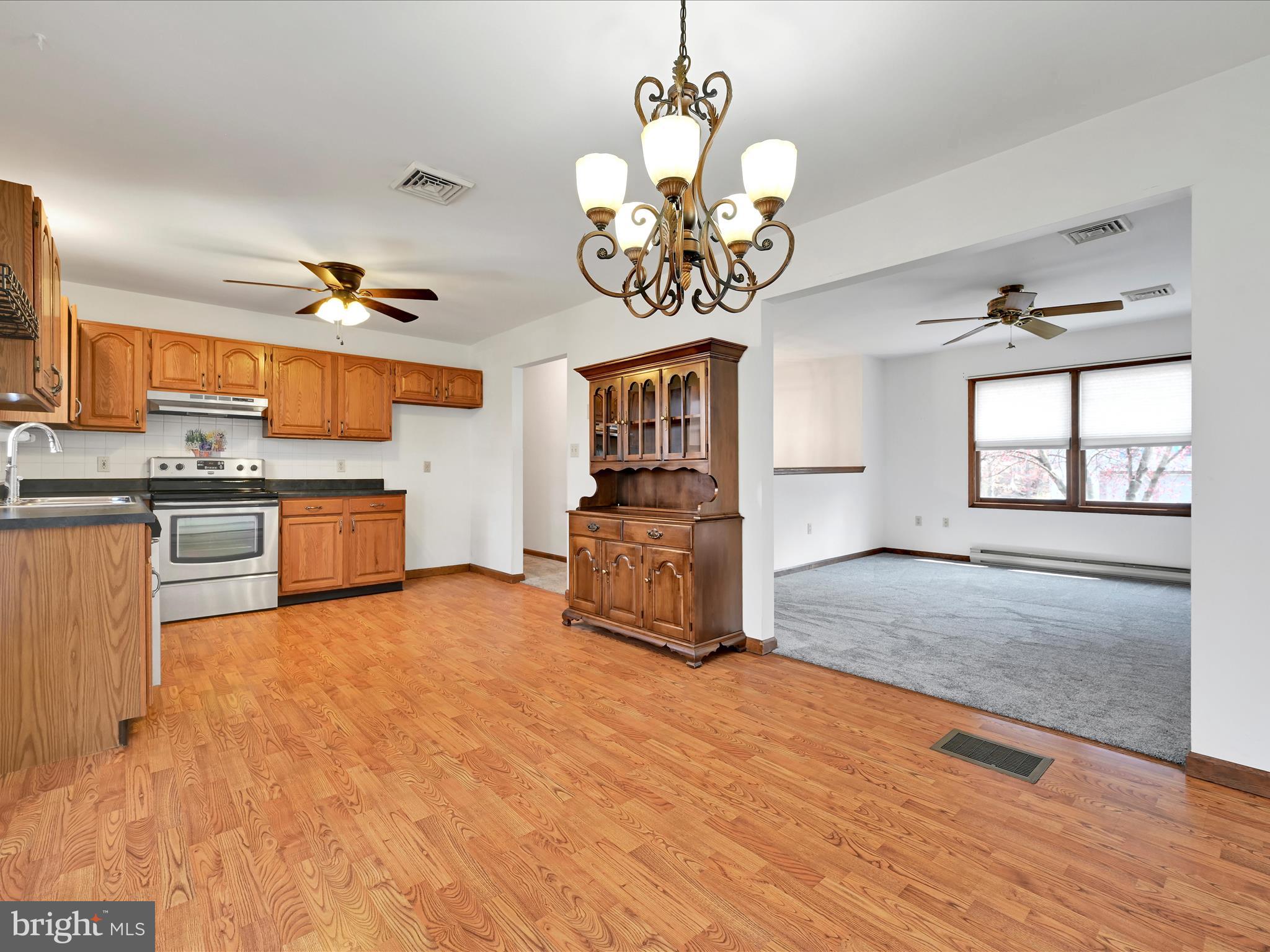 5 T-992 Stevens, PA 17578 - Photo 11 of 34 a view of a kitchen with a sink stainless steel appliances and cabinets