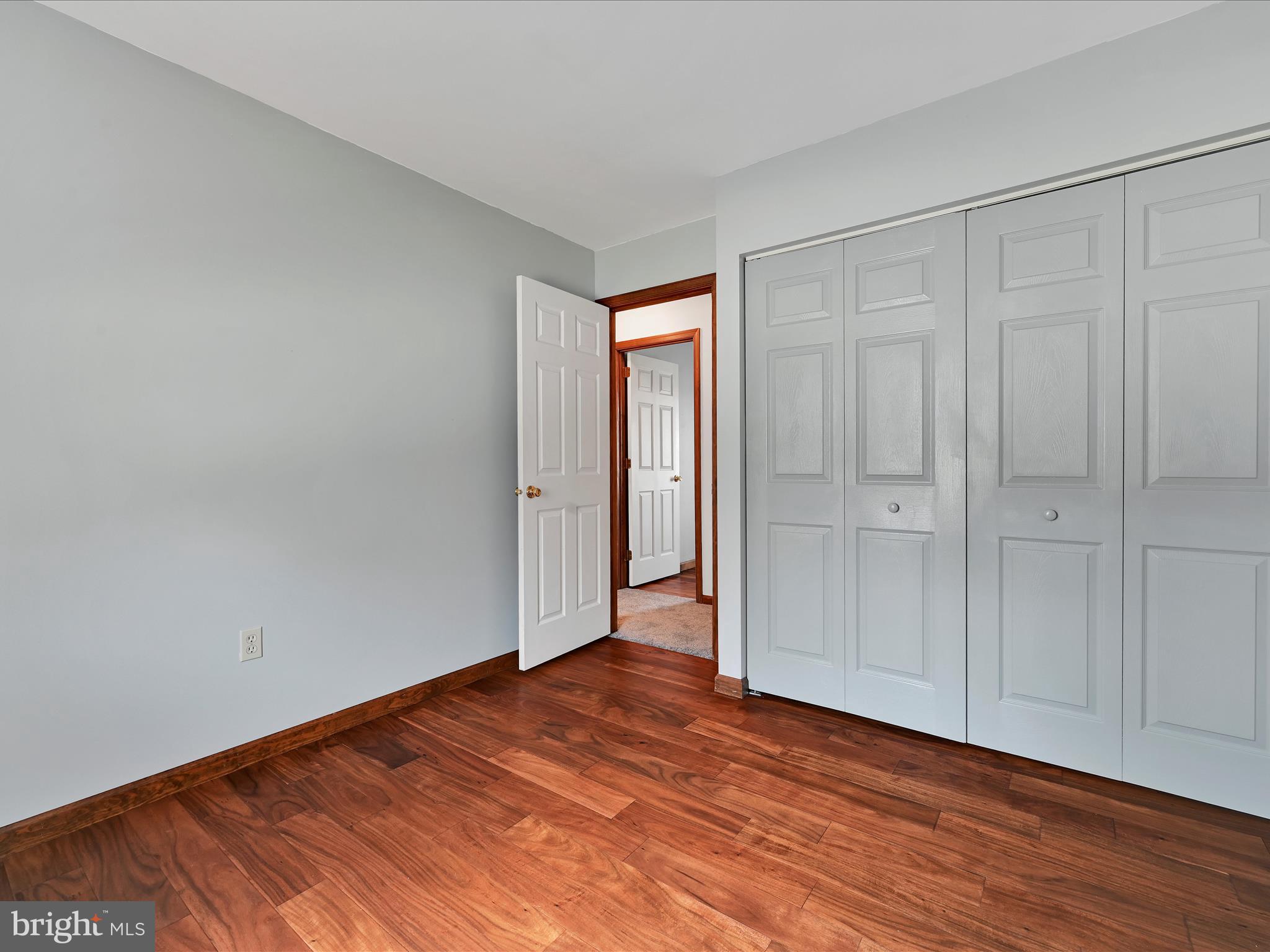 5 T-992 Stevens, PA 17578 - Photo 19 of 34 a view of an empty room and wooden floor