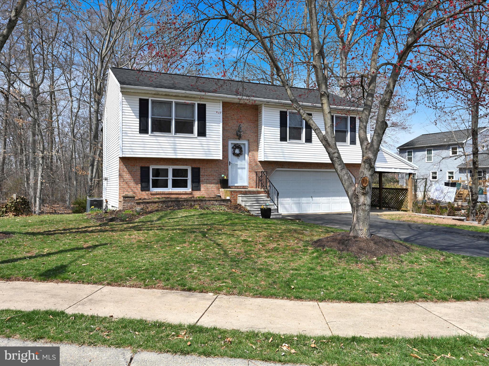 5 T-992 Stevens, PA 17578 - Photo 4 of 34 a front view of a house with a yard