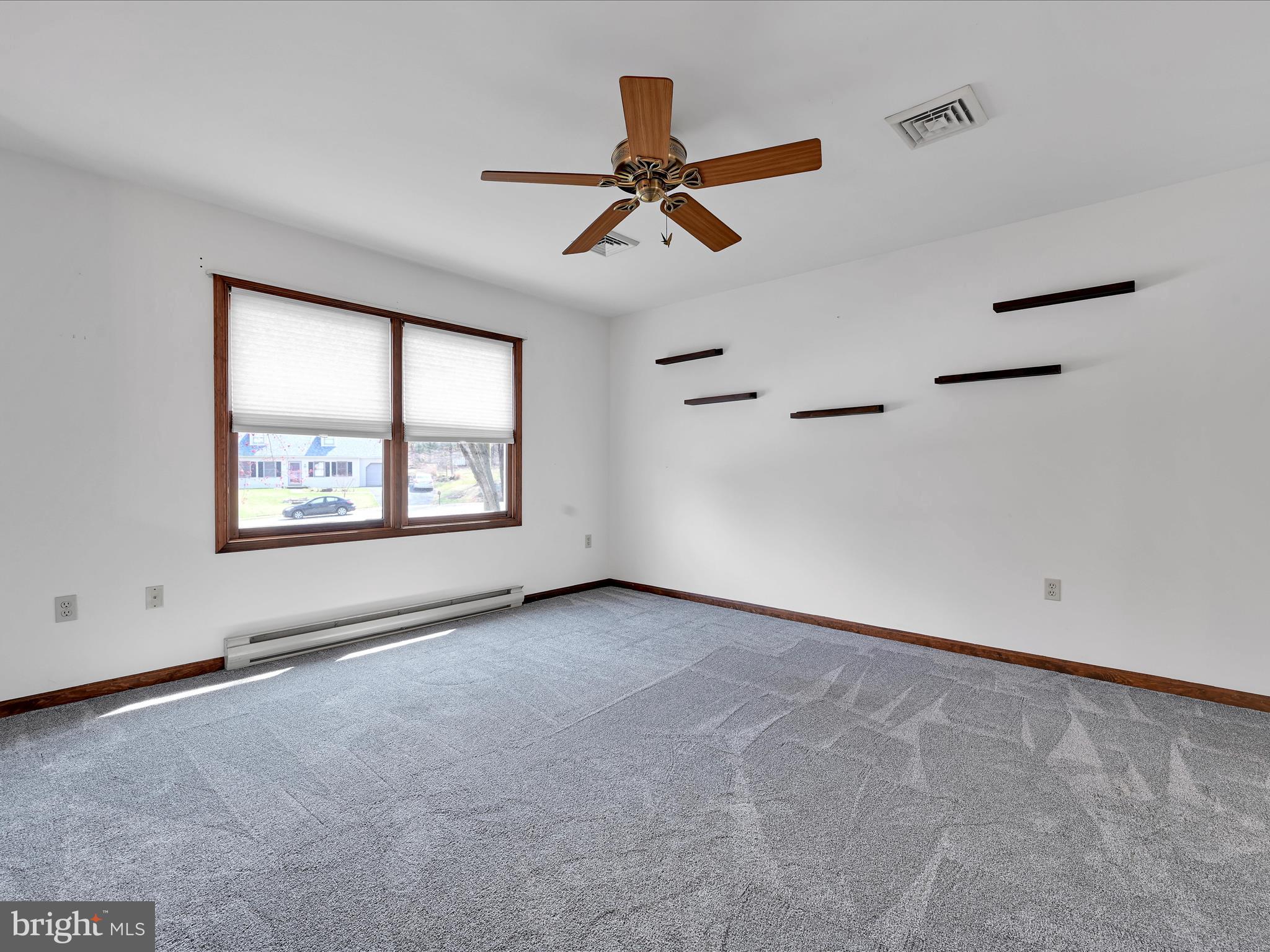 5 T-992 Stevens, PA 17578 - Photo 8 of 34 an empty room with windows and fan